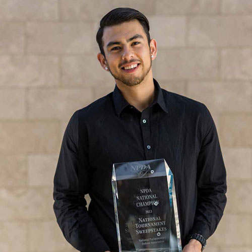 Diego Perez standing with trophy